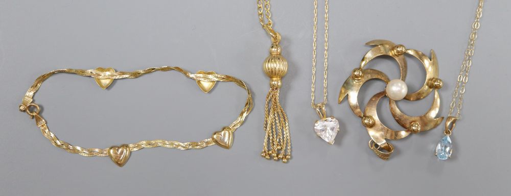 A 9ct gold and pearl openwork flower pendant, a 9ct tassel pendant on chain and three other items,